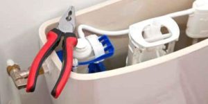 Comment régler ou remplacer le flotteur dun WC ?